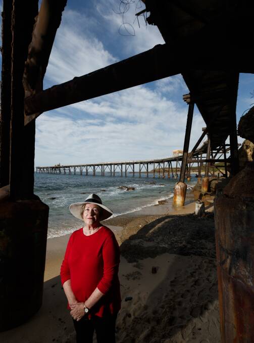 Sue Whyte, president of the Catherine Hill Bay Progress Association, beneath the town's iconic jetty.