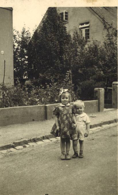 THEN: A young Anna Adnum (nee Anika Nedelko) with her brother Michael. The family came to Australia in the 1950s after fleeing war-torn Ukraine. 