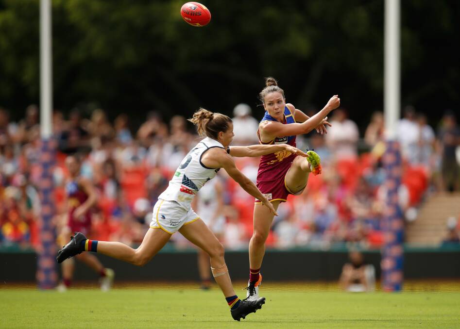 GAME ON: Emily Bates and Chelsea Randall during the AFLW grand final last month. While women's sport is moving in the right direction, more can be done at a local level.