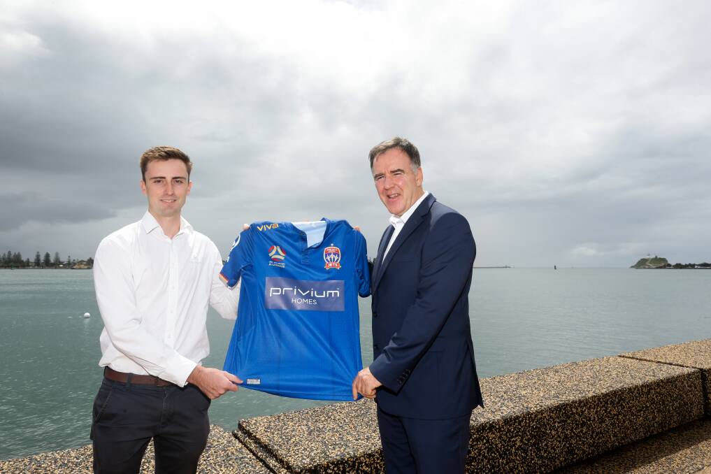 Newcastle Jets CEO Lawrie McKinna, right, announces new sponsorship deal with Privium Homes. Karl Hellyar, left. Picture: Jonathan Carroll