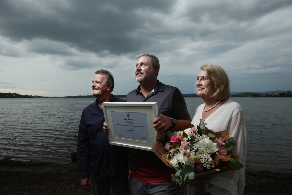 Remembering: Meg Purser's father Bob, partner of 21 years Scott Mills and mother Noelene Purser accepted the award at Warners Bay on her behalf. Mr Mills said they felt ups and downs after losing her, but were surrounded by kindness. Picture: Simone De Peak