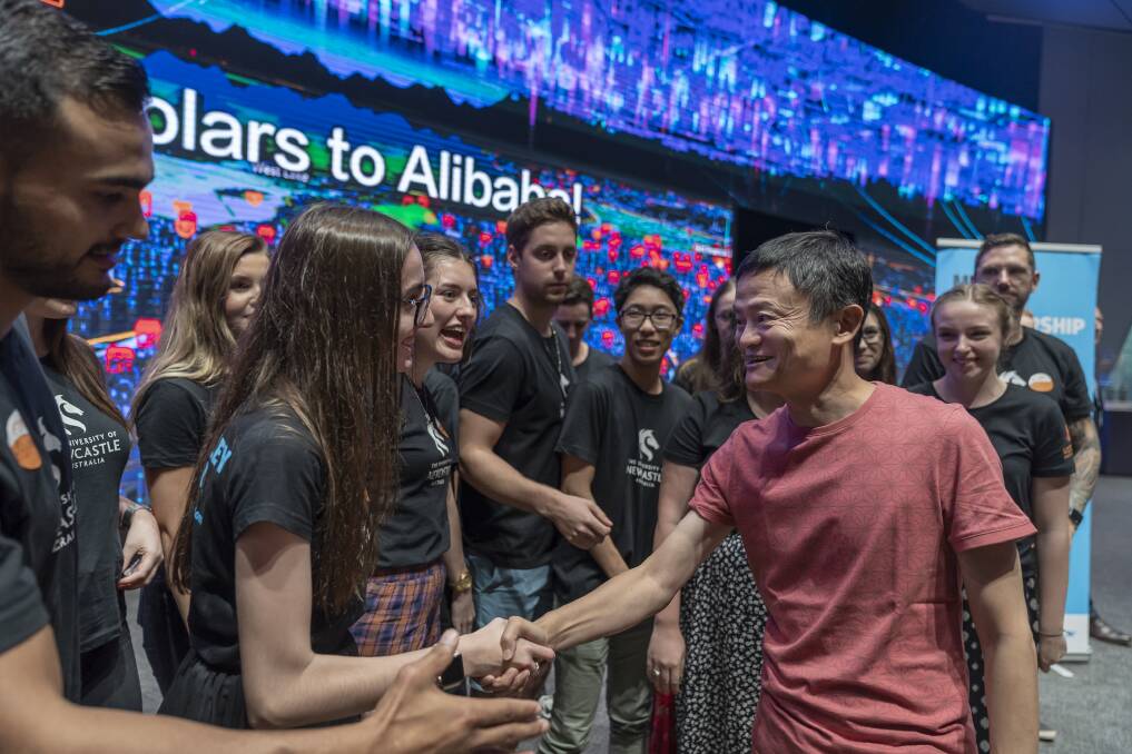 Unique: Tara Tolhurst from Stroud shakes Jack Ma's hand. Mr Ma is frequently listed as one of the world's most powerful people and is also a philanthropist. Applications for 2020 scholarships open in August. Picture: Conor Ashleigh
