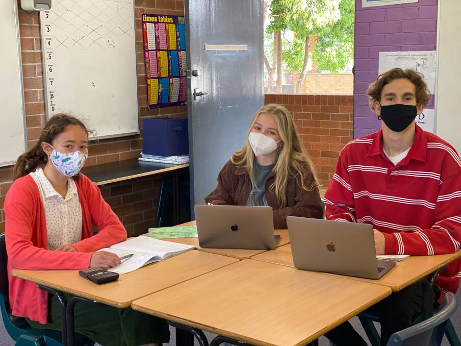 Connection: Isabella Fung, Chloe Linstrom and Toby Stuart were among 74 students that visited on Friday for maths revision in bubbles. The school has tentatively booked the cohort's graduation and formal, pending a further easing of restrictions.