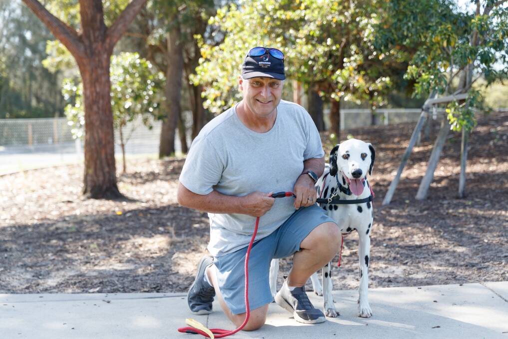 Ken Dodkins said 18 month old Marley was "not hard to love" and kept him healthy with lots of walks. They go to Speers Point fenced dog exercise area at least four times a week. Picture by Max Mason-Hubers