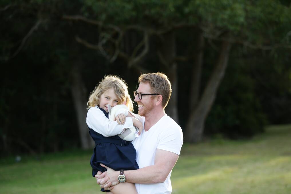  Perspective: Anthony Piggott, with his daughter Anita, said they were taking remote learning one day at a time. "There's lots of love, lots of cuddles, lots of fun as well, so she'll be fine." Picture: Jonathan Carroll