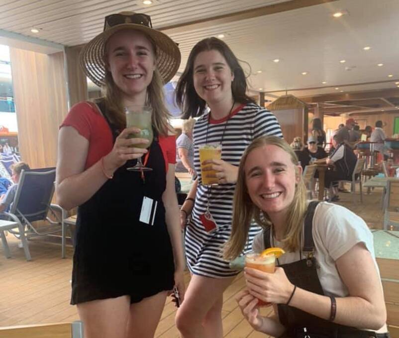 Smooth sailing: Isabella, Charlotte and Kaitlyn Young soon after receiving their ATARs aboard their cruise. They later danced the night away in the ship's nightclub.