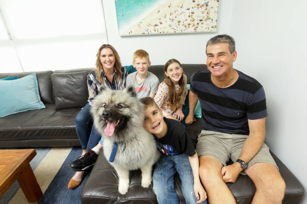Hope: Isaac Allen (front) with dog Baron and mum Liesel, dad Steve and siblings Noah and Bianca. "We are the allergy capital of the world yet we've been doing so little about it," Mrs Allen said. "We just want the same access to healthcare that other countries have." Picture: Jonathan Carroll