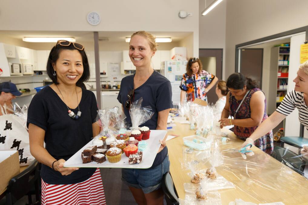 Sweet treats: Parent volunteers Ying McKenzie and Louise Crosskill said biscuits, slices, lollies, cupcakes, chocolate-dipped marshmallows and donuts would be for sale, along with the barbecue. Picture: Max Mason-Hubers