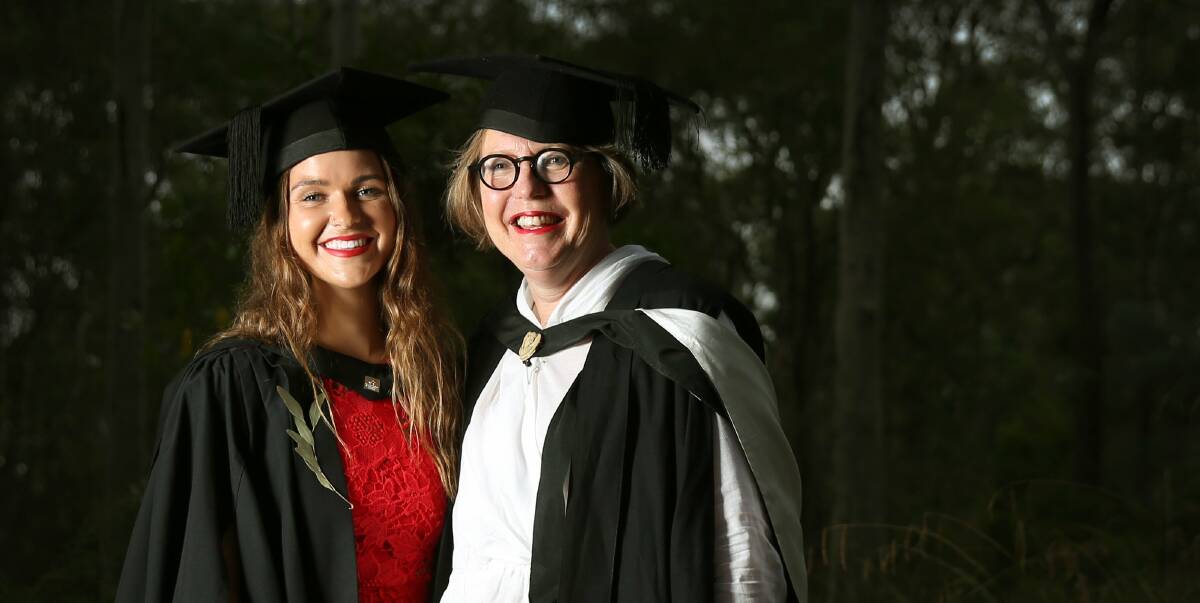 Support: Graduate Isabel Enks and her "hugely influential" lecturer Sher Campbell. "I just kept plugging away and took it day by day," Isabel said about her five-year degree. "Today, I feel on top of the world." Picture: Marina Neil