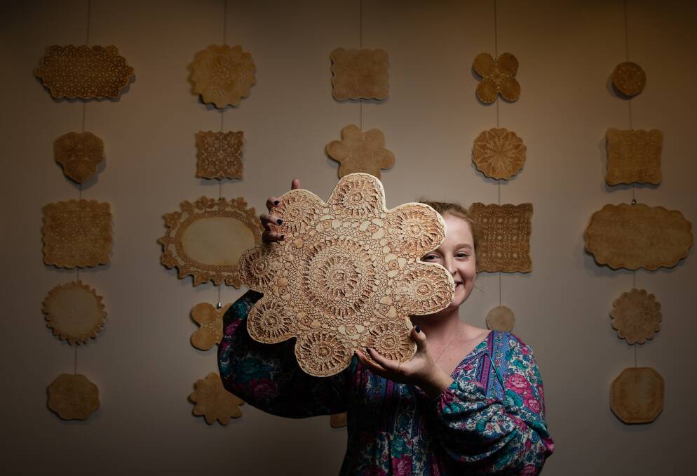 Goal: Kristen Lawrence said graduating in the same week as launching her first solo exhibition, the "sentimental" Lace and Lineage, felt "like coming full circle". It includes transforming doilies into artworks. Picture: Marina Neil