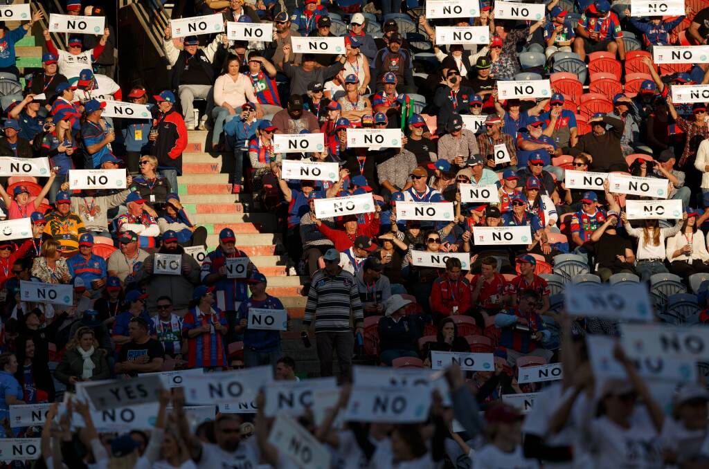 Speak up: Attendees at the Newcastle Knights versus Gold Coast Titans game at McDonald Jones Stadium last year held up 'no to domestic violence' banners. Picture: Max Mason-Hubers 