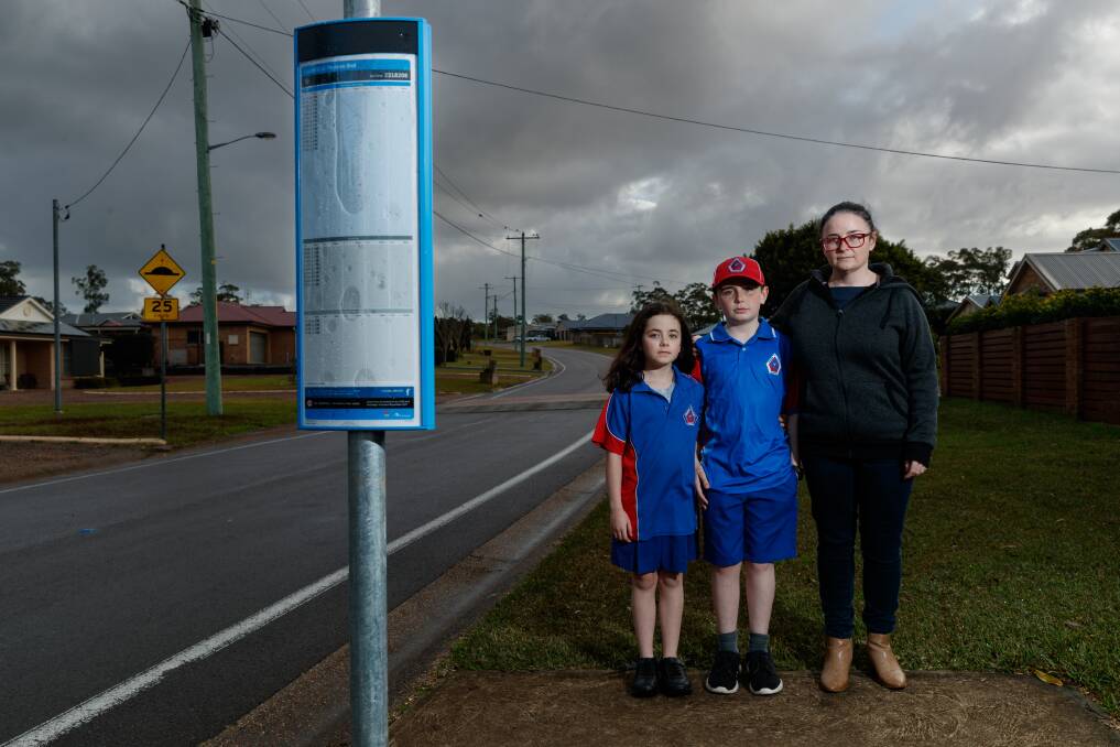 Concerned: Jacquie Stokes (right), with Kaylee and Lucas, said Hunter Valley Buses should have told her school about the cancellation. "Our kids should not be standing on the road for that period of time." Picture: Max Mason-Hubers