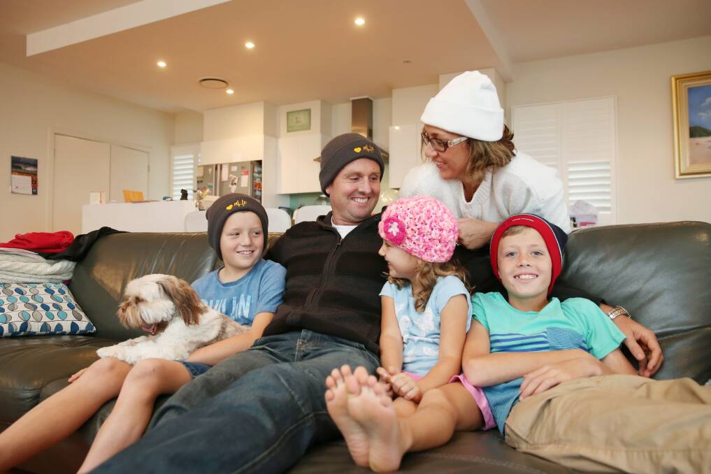 GRATEFUL: Mark Hughes with wife Kirralee, children Dane, Bonnie and Zac and dog Teddy, encouraged the community to don a beanie during the next month and donate to brain cancer research. Picture: Max Mason-Hubers
