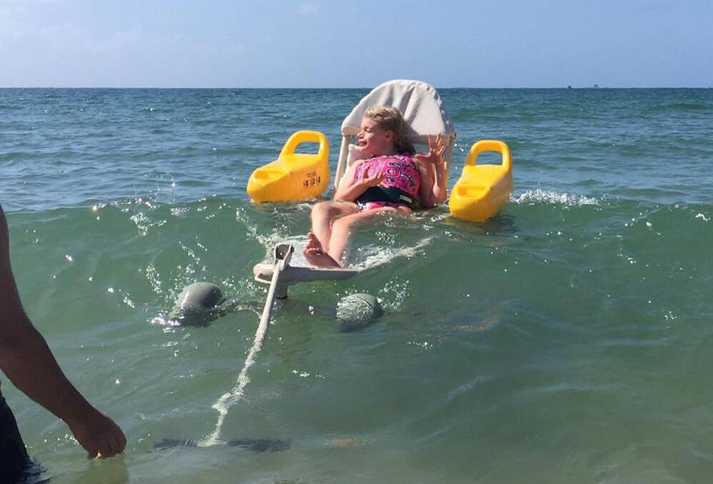 Buoyant: Chriselle Clement said the floating KSM chair will make trips to the beach with daughter Marlee easier and more enjoyable. Picture: Chriselle Clement
