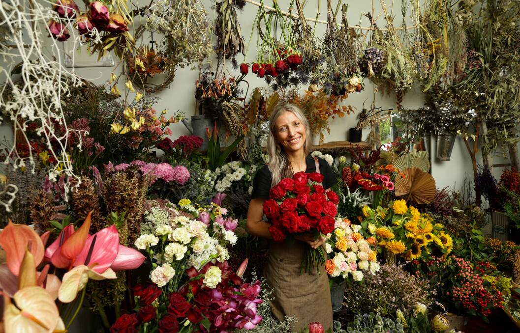 Flourish: Florist Rachel Higgins expected to have only a few hours of sleep on Thursday before a busy Valentine's Day, setting up from 5am, opening at 7am and working for as long as customers are visiting. Picture: Jonathan Carroll