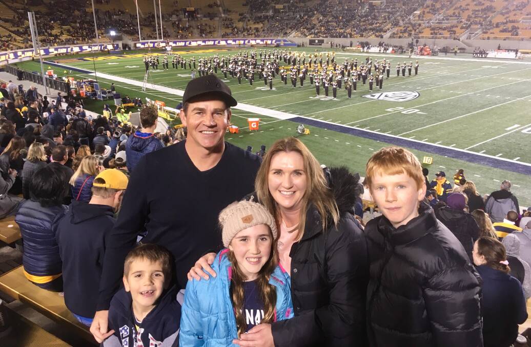 Adventure: The Allen family, from left, Isaac, Steven, Bianca, Liesel and Noah at a college football game. Mrs Allen writes about her family’s OIT journey on a Facebook page called Isaac’s Mission. “When you know the way, light it for others,” she said. “I hope other families do not have to go through the expense and struggles we have.”