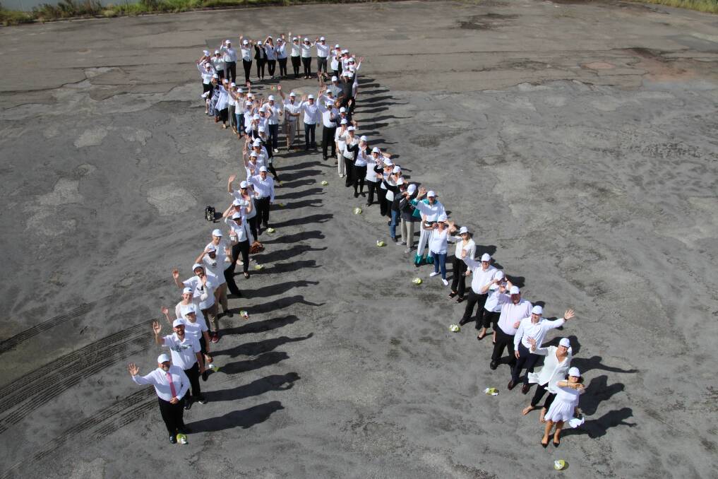 Positive sign: Samaritans staff stood in the shape of a White Ribbon in Warabrook on Monday. Staff were surveyed at the beginning and end of the 18 month accreditation process. The accreditation is valid for three years. 