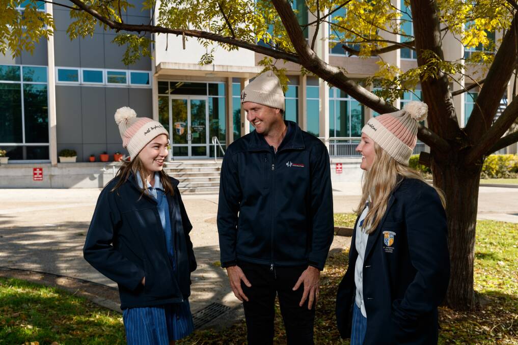 Courageous: Abby Ward, Mark Hughes and Tess Peel. Hughes said he saw every beanie as a "symbol of hope". Picture: Max Mason-Hubers