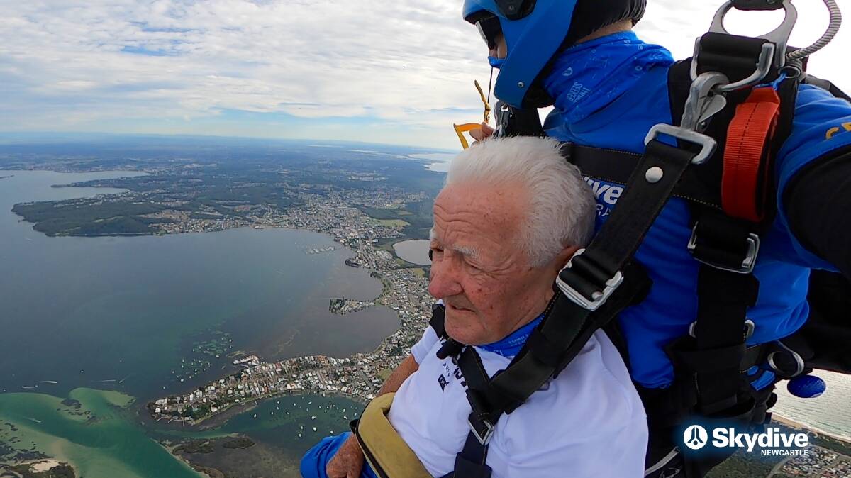 Soaring: Bill Lennon said he had hung his skydiving photographs and certificates on his "bragging wall" in his "man cave". He plans to dive on every birthday while he can. Picture: Skydive Australia