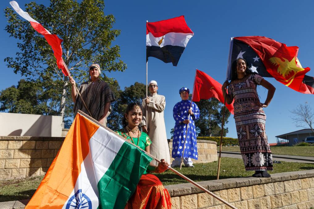 Culture: Lucas Gibson with the Chile flag, Egypt-born Mahmoud Khamis, India-born Mirusna Balasubramanian, Brandon Luu with the Vietnam flag and Megantha Kiruwi with the Papua New Guinea flag. Pictures: Max Mason-Hubers