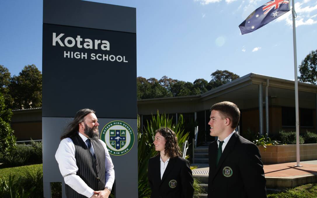 Kotara High principal Mark Snedden with last year's captains Meg Donnan and Heath Goodman. Picture: Jonathan Carroll
