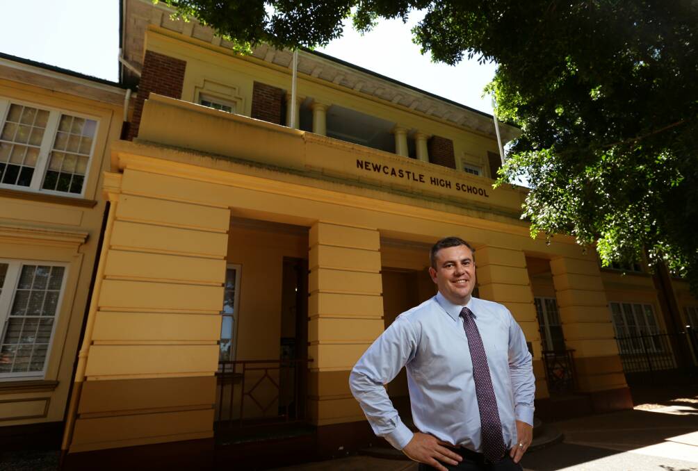 Responsibility: Nathan Towney has the name of every previous Newcastle High principal written above his office door. Picture: Jonathan Carroll
