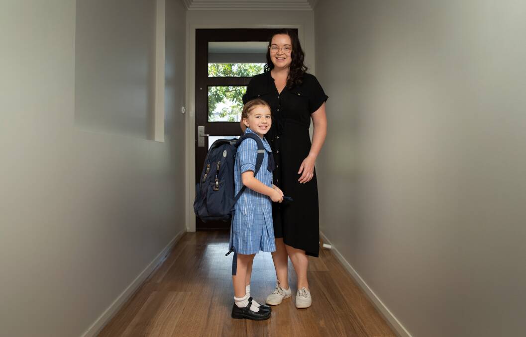 Ready to go: Evie Moy, pictured with mum Sarah, returned to her karate and dancing lessons last week and will be back in the classroom this week. Picture: Marina Neil