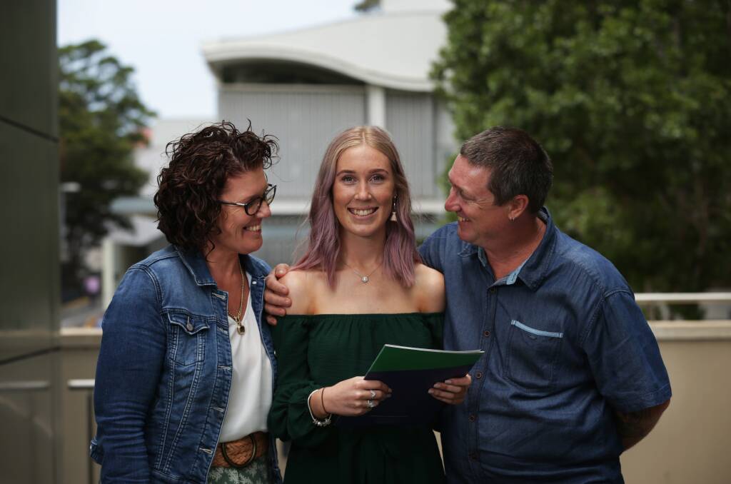 Star: Ellie Waight, with parents Tanya and Nick, paid tribute to her teacher Kristy Neilson, who she said was supportive, kind hearted and "went above and beyond and did everything she could for us". Picture: Simone De Peak