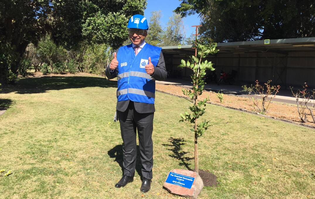 THUMBS UP: Liberty House chairman and UK billionaire Sanjeev Gupta with a tree plantation celebrating the Mayfield site's new ownership.