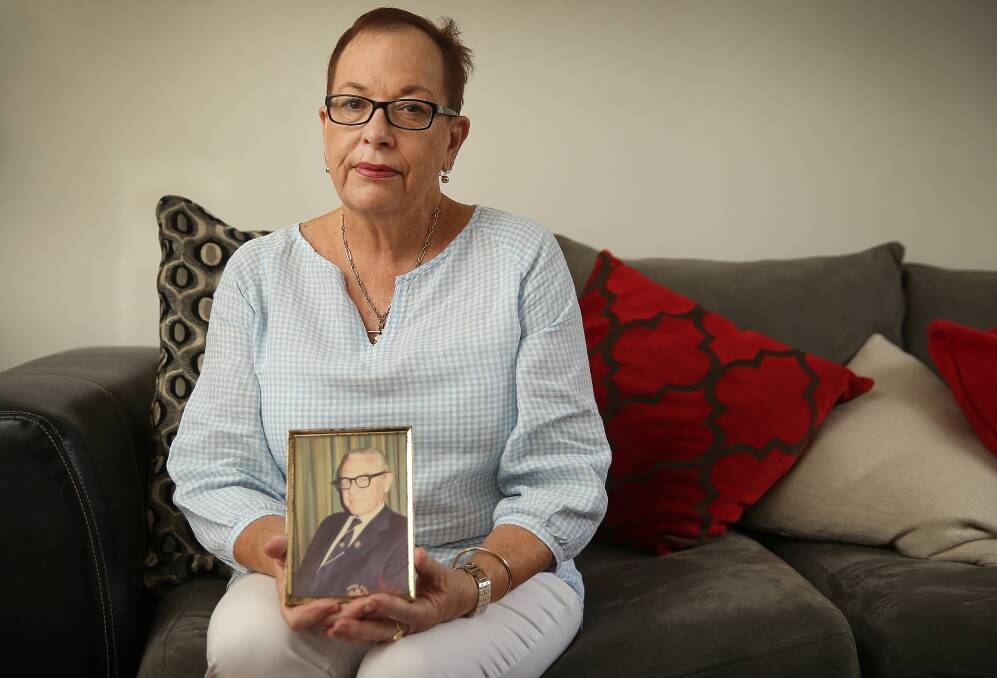 Donna Bartley holds a picture of her father, Bernie Farrell, who died after he was hit by a hit-and-run driver. Picture: Marina Neil