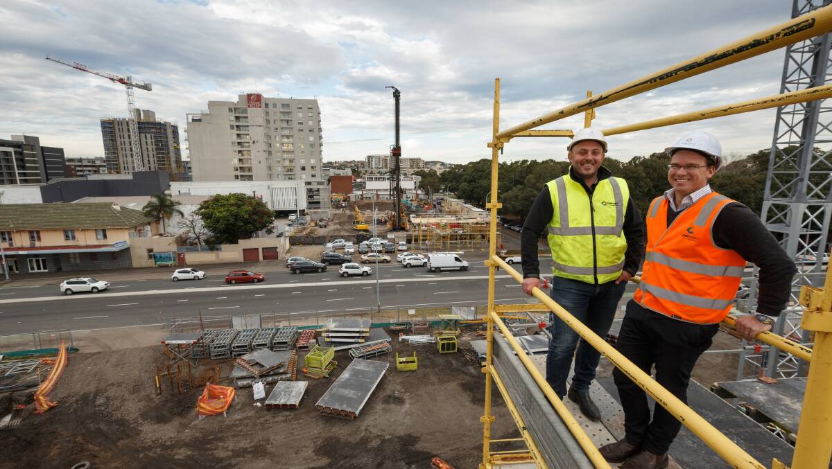 GRAND PLANS: Newcastle developers Tom Elliot and Jamie Lind overlooking Little King Street. Picture: Max Mason-Hubers