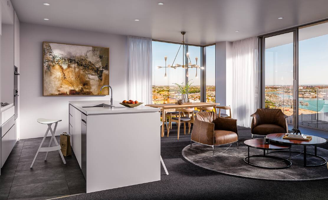 HIGH-RISE LIVING: An artist's impression of the kitchen and living areas, and harbour views, in one of Verve's 197 units.