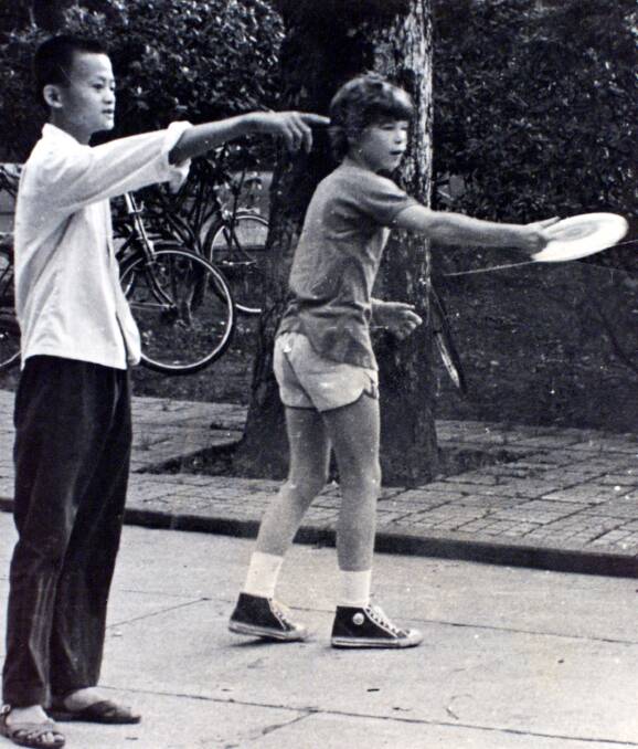 Jack Ma playing frisbee with young David Morley. Picture: Supplied
