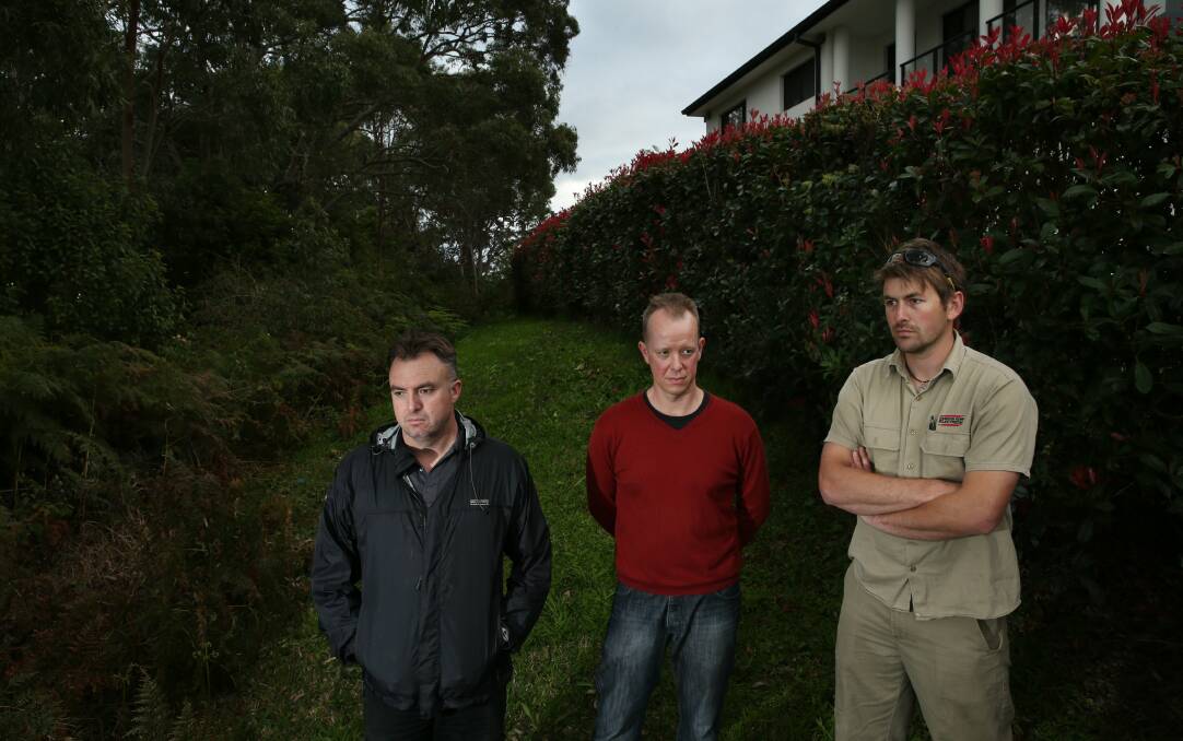 NOT HERE: Algona Road residents Mark Bartrom, Andrew Tiller and Andrew Fuller on the site where Optus wants to build a mobile phone tower. Picture: Max Mason-Hubers