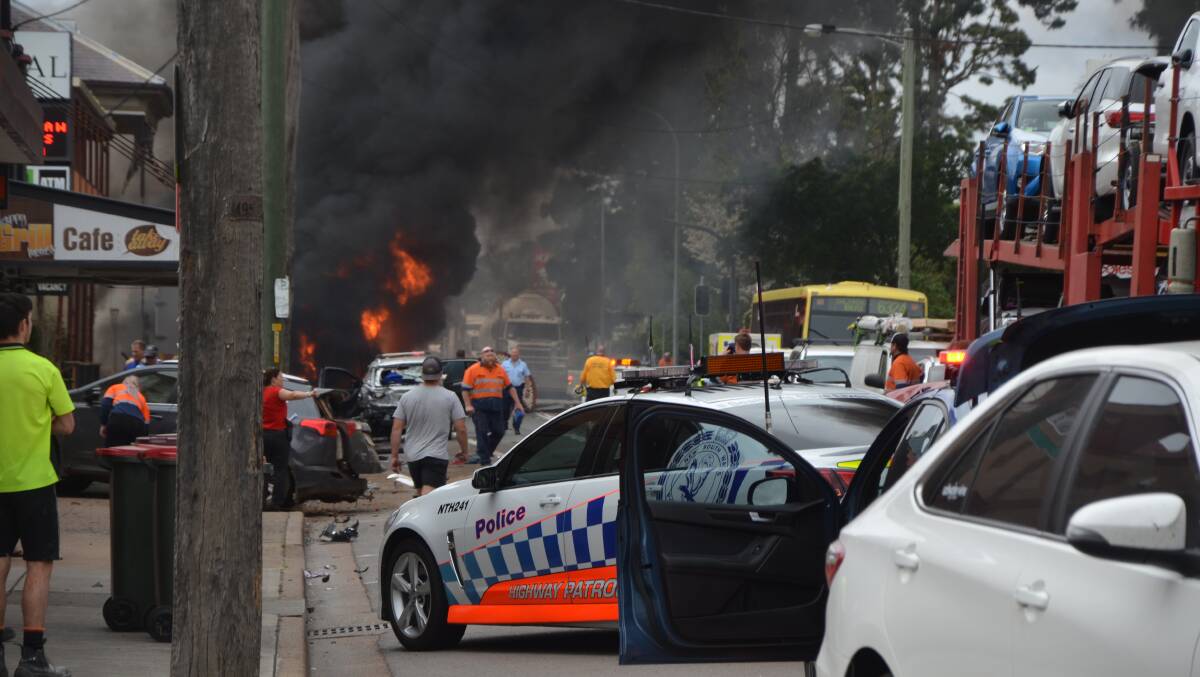 FLAMES: Emergency on George Street after the truck crash. Picture: Singleton Argus