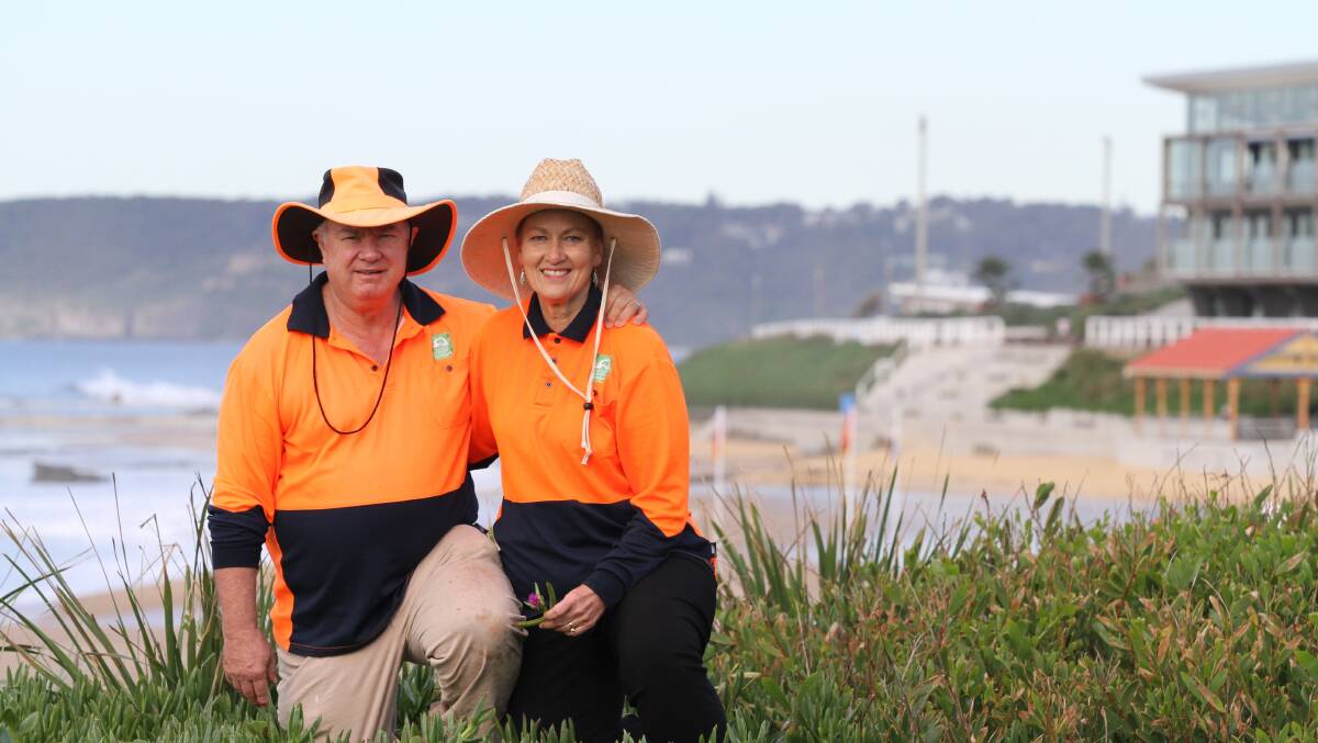BIG THINGS GROW: Husband and wife Chris Marley and Barbel Stuhr on the job improving the coastline at Merewether. 