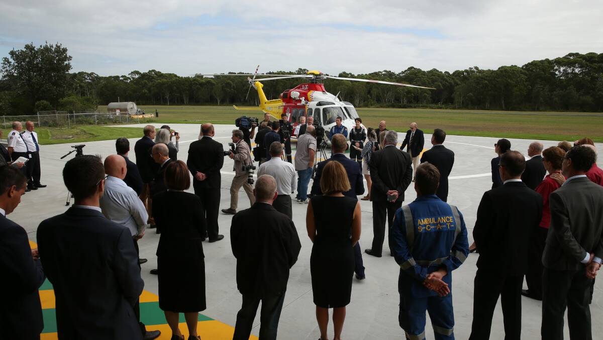 Guests watch on as officials unveil the new fleet on the tarmac at Belmont. Picture: Max Mason-Hubers