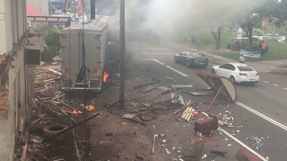 DESTRUCTION: Smoke billows out of the truck after it crashes into a power pole. Picture: Supplied