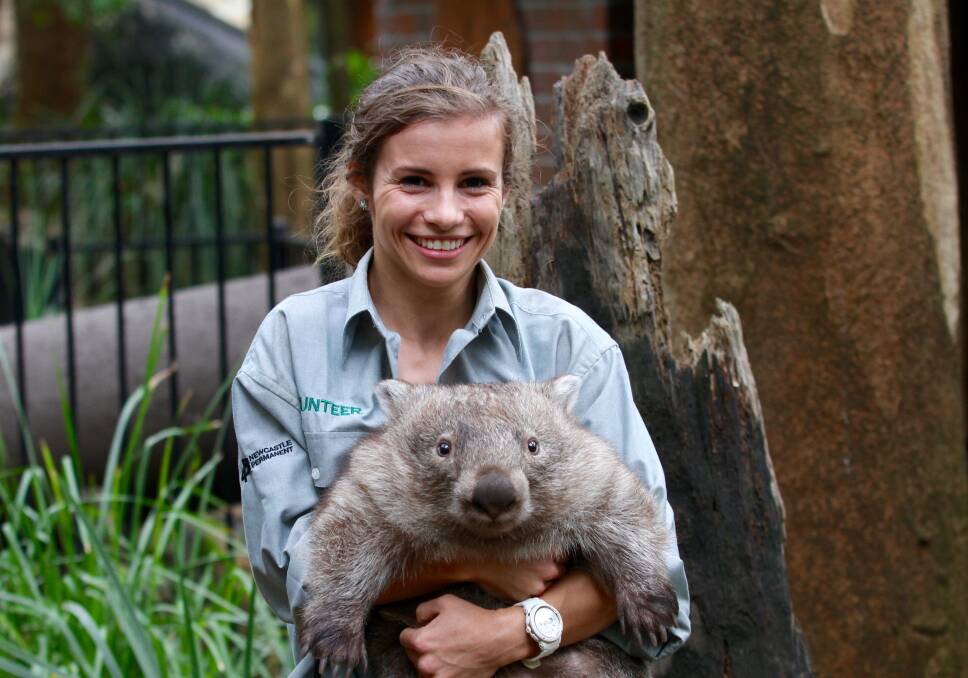 FURRY FRIEND: Hannah Maguire volunteers for Newcastle City Council at Blackbutt Reserve, where she enjoys educating others about wildlife.