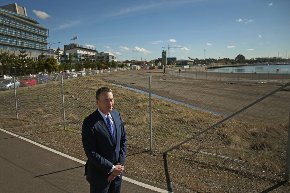 MONEYSUCKLE: Hunter Development Corporation chief executive Michael Cassel at 35 Honeysuckle Drive on Thursday. The site is expected to fetch more than $10 million. Picture: Marina Neil