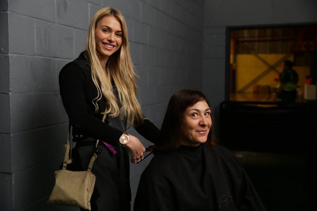 HELPING HAND: Veronica Bokodi receives a hair cut from Pandora's Hair Witchery hairdresser Danielle Gillies. Picture: Jonathan Carroll