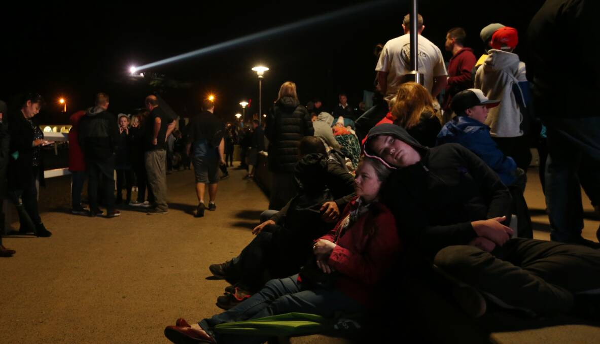 Crowds up early for the Nobbys dawn service, one of the most well-attended in Australia. Picture: Simone De Peak