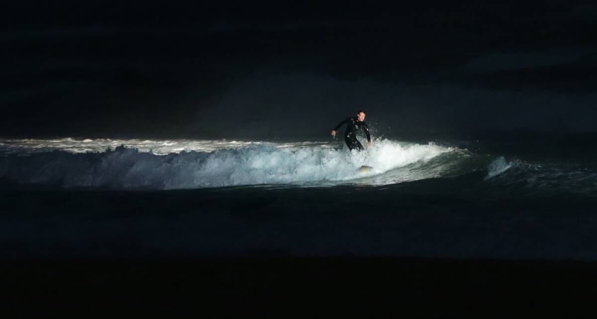 A lone surfer soaks up the spotlight. Picture: Simone De Peak