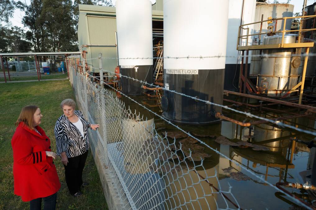 FURIOUS: Maitland MP Jenny Aitchison, left, and Rutherford resident Ramona Cocco said taxpayers should not be left holding the bill for the clean up of derelict Truegain waste-oil refinery plant. Pictures: Max Mason-Hubers 