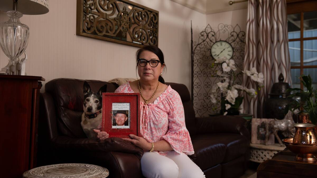 DEVASTATED: Tara French holding a picture of her late husband Harold who had been friends with David Ashard for more than 40 years. Tara said Ashard used their friendship to get them to invest in one of his failed inventions. Picture: Marina Neil 