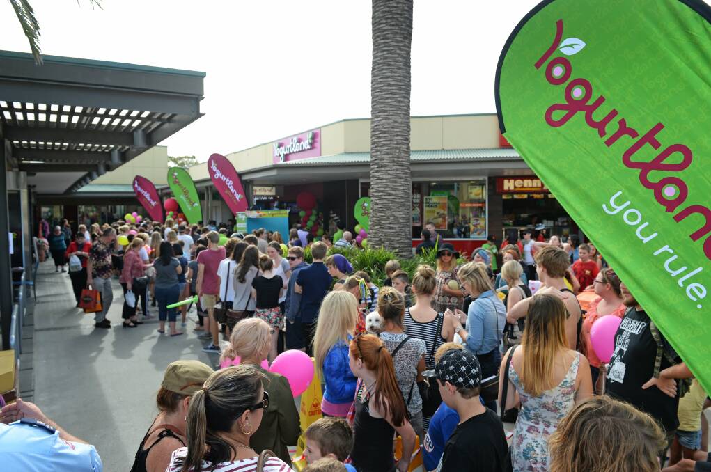 SWEET TREATS: Opening day of Newcastle's Marketown Yogurtland store in April 2014. Customers tried to beat the record for the most number of free frozen yoghurts eaten. Picture: Marina Neil
