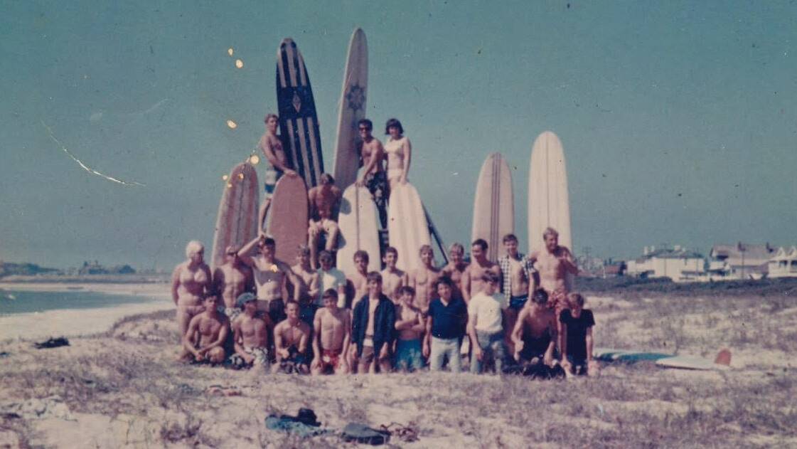 SURF'S UP: A group of locals on Stockton beach's extensive sand dunes along Mitchell Street in 1966. Picture: Geoff Smith 