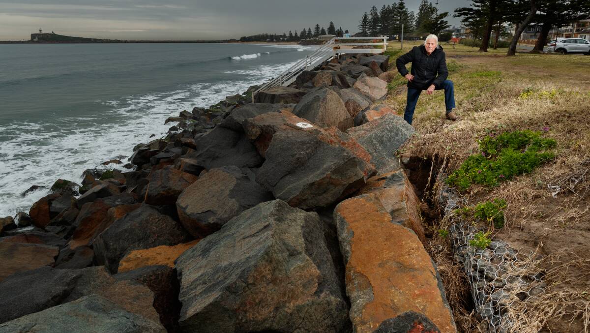CONCERNED: Stockton resident Al Metcalfe at the Mitchell St seawall that is increasingly being undermined by erosion. Picture: Max Mason-Hubers