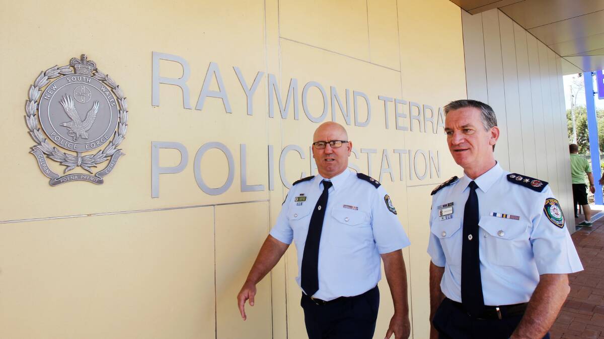 ON DUTY: Then NSW police commissioner Andrew Scipione at Raymond Terrace in 2014 with Craig Rae when he was Port Stephens Local Area Command boss.