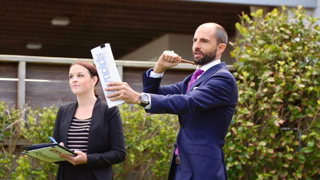 BIG RETURNS: Newcastle property auctioneer and race-car driver Gavan Reynolds is the owner and former director of high-interest rate lender Oakland York, which was placed in liquidation last year. Picture: Simone De Peak